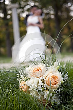 Wedding day dance, kisses and bouquet of flower