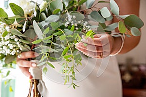 Wedding day decorations, bouquet with white flowers and eucaliptus, cute details