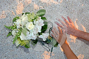 Wedding day hands on beach