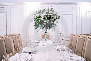 Wedding decor, accessories, orchids,  eucalyptus, a bouquet in a restaurant,