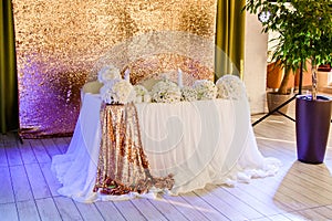 Wedding decor. Bouquets of white flowers on the wedding table in restaurant