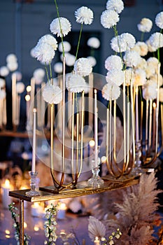 Wedding decor in dark Candles, white dried flowers