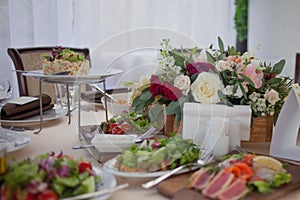 Wedding decor. Flowers in the restaurant, food on the table