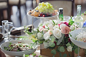 Wedding decor. Flowers in the restaurant, food on the table