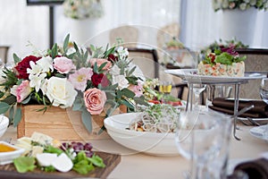 Wedding decor. Flowers in the restaurant, food on the table