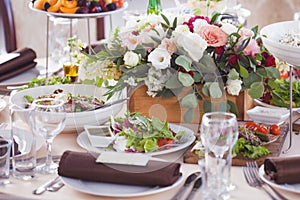 Wedding decor. Flowers in the restaurant, food on the table