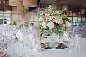 Wedding decor. Flowers in the restaurant, table setting