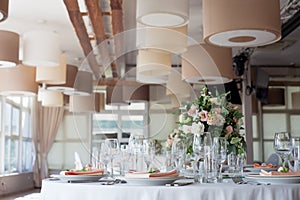 Wedding decor. Flowers in the restaurant, table setting