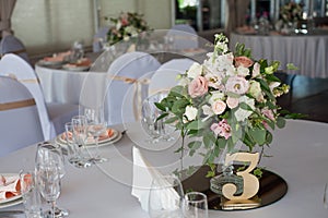 Wedding decor. Flowers in the restaurant, table setting