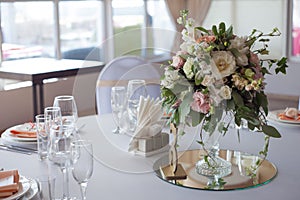 Wedding decor. Flowers in the restaurant, table setting