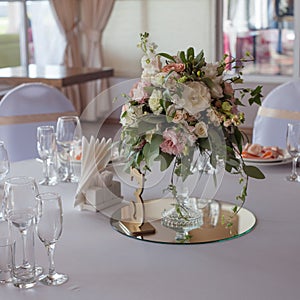 Wedding decor. Flowers in the restaurant, table setting