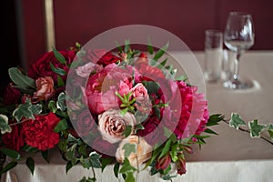 Wedding decor. Red Flowers in the restaurant, table setting