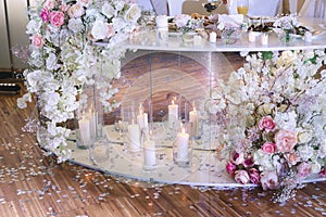 Wedding decor in a restaurant with candles and flowers