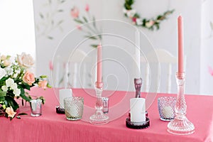 Wedding decor. Table for the newlyweds outdoor. Wedding reception. Elegant table arrangement, floral decoration, restaurant