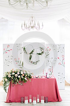 Wedding decor. Table for the newlyweds outdoor. Wedding reception. Elegant table arrangement, floral decoration, restaurant