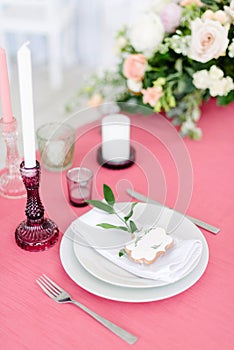 Wedding decor. Table for the newlyweds outdoor. Wedding reception. Elegant table arrangement, floral decoration, restaurant