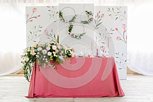 Wedding decor. Table for the newlyweds outdoor. Wedding reception. Elegant table arrangement, floral decoration, restaurant