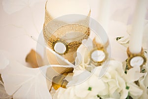 Wedding decor in white and gold style with crystals, lace and flowers.