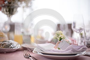 Wedding decorated table. Luxury light decor on table in restaurant