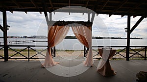 Wedding decoration. Arch. Cage. Wedding setup on the beach. wedding arch. Banquet hall on the shores. Wedding ceremony