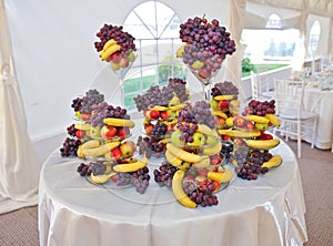 Wedding decoration with fruits, bananas, grapes and apples