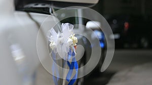 Wedding decoration of luxurious white car on night road