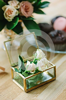 Wedding decoration - small rose flowers in a glass casket