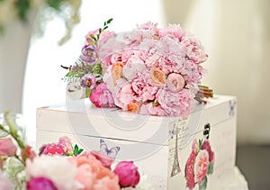 Wedding decoration on table. Floral arrangements and decoration. Arrangement of pink and white flowers in restaurant for event