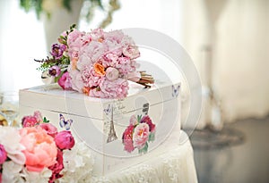 Wedding decoration on table. Floral arrangements and decoration. Arrangement of pink and white flowers in restaurant for event