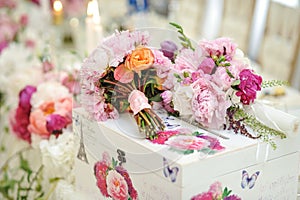 Wedding decoration on table. Floral arrangements and decoration. Arrangement of pink and white flowers in restaurant for event