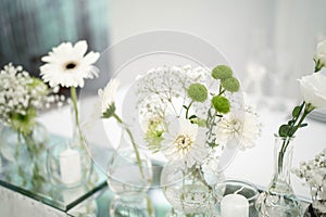Wedding decoration table in the hall, floral arrangement. In the style vintage. Decorated dining table with flowers for