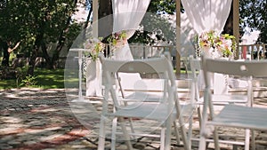 Wedding decoration, wedding reception set outdoors under bright sun on resort