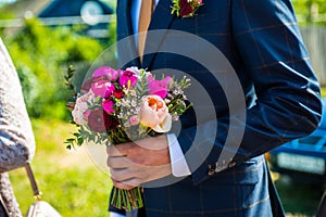 Wedding decorations, the bride`s bouquet, lies and waits until the bride wears her wedding dress