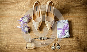 Wedding detail. Accessories for the bride. Shoes, rings, earrings,bracelet and boutonniere