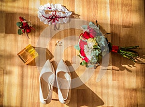 Wedding detail. Accessories for the bride. Shoes, rings, earrings,bracelet and boutonniere