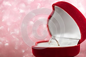 Wedding diamond ring in red heart shaped gift box