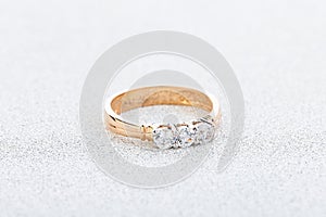 Wedding diamond ring on white glossy background