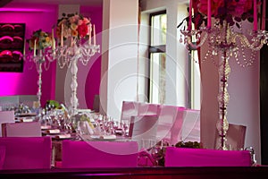 Wedding dinner table in purple light
