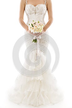 Wedding Dress, Beautiful Bride in Elegant Sexy Gown holding Flowers Bouquet on White