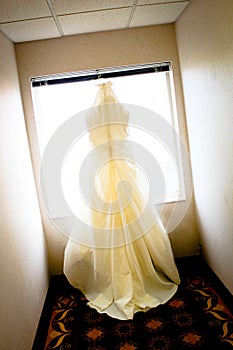 Wedding Dress Hanging in Window