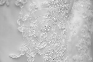 Wedding dress lace detail close up black and white view. female fashion costume details and luxury retro clothes