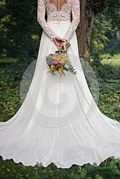 Wedding dress and rustic bouquet.