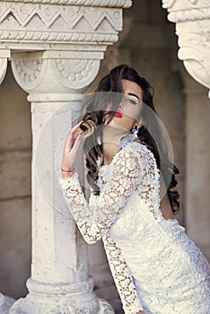 Wedding dress salon advertisment. Fashion woman body. Woman model posing. Woman with long brunette hair. Sensual woman