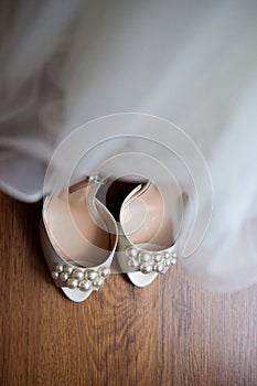 Wedding dress and shoes in a room