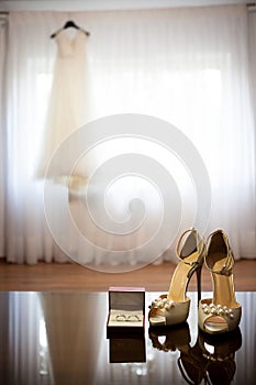 Wedding dress and shoes in a room