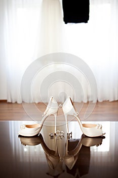 Wedding dress and shoes in a room