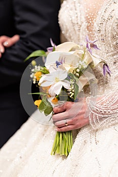 wedding dress, wedding rings, wedding bouquet