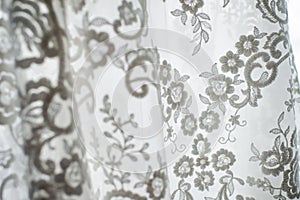 Wedding dress. White floral lace from a wedding dress. Details.