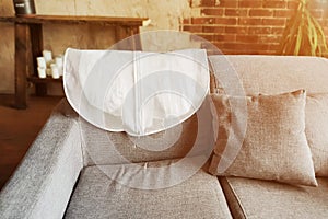 Wedding Dress in White Hanging Garment Bag on the back of the Couch. The morning before the wedding