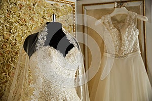 Wedding dresses on hangers and dummies